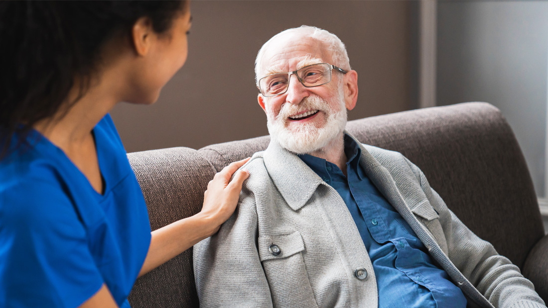 Pharmacist consulting with an elderly patient