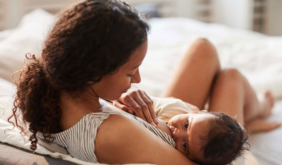 Woman breast feeding a baby