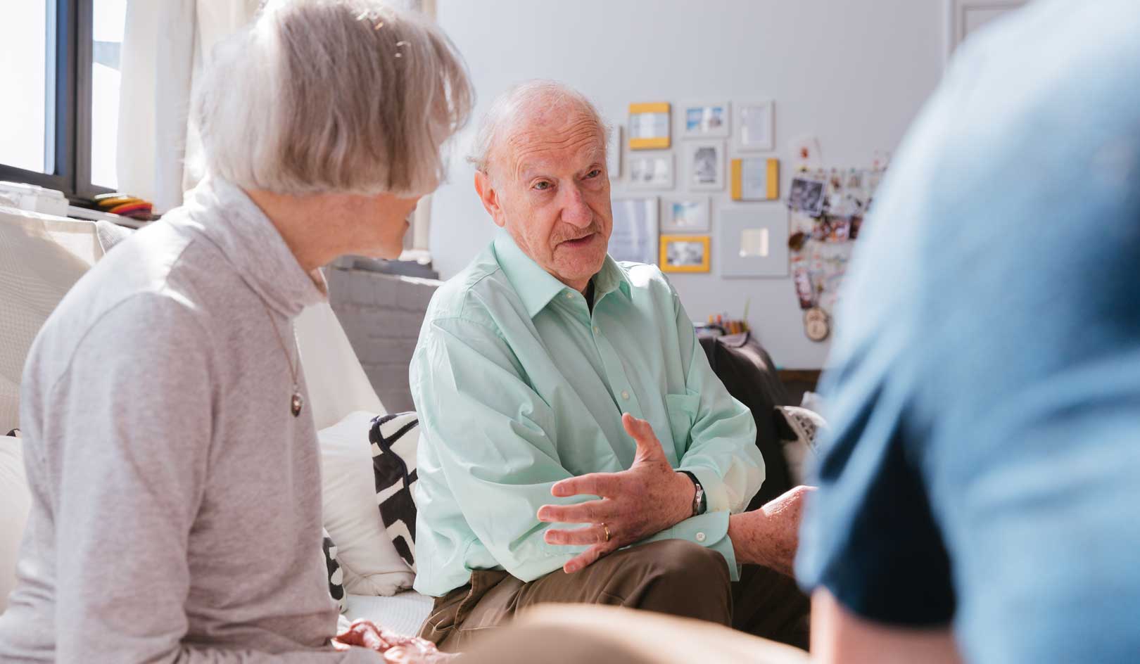elderly people having a conversation